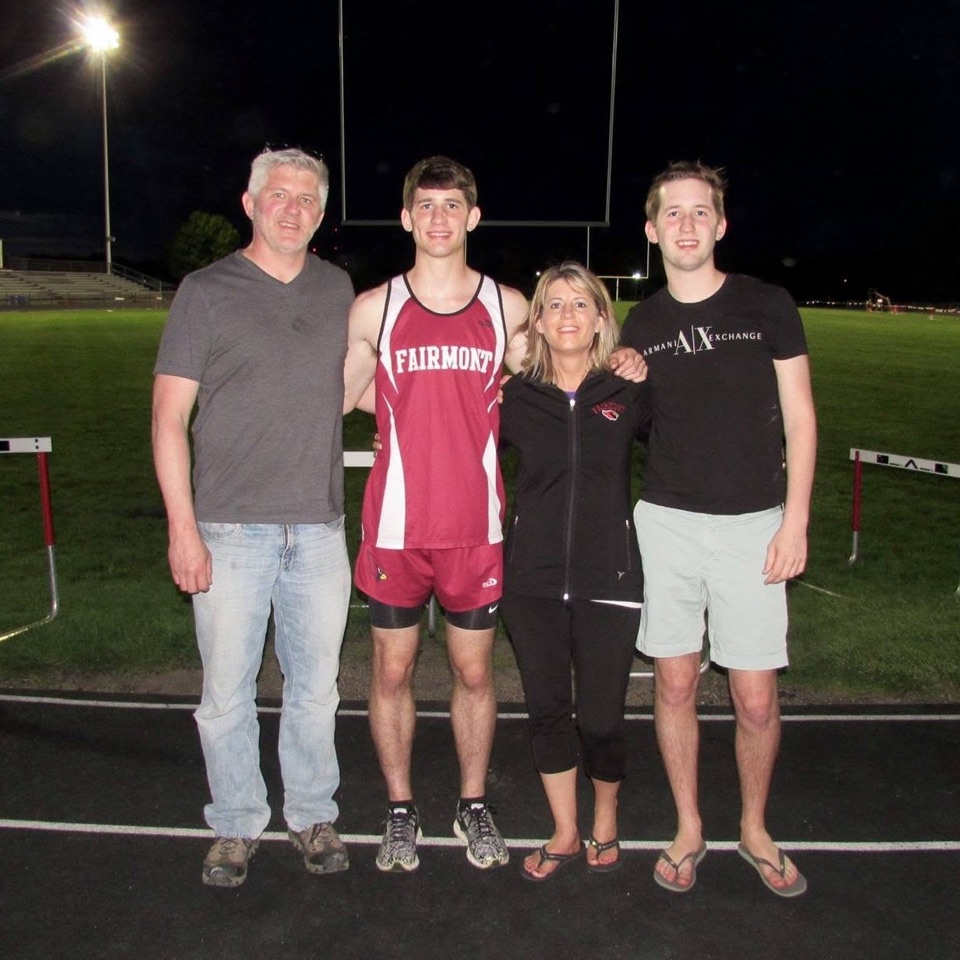 Josh Liljenquist in a Fairmont track uniform with family during his early athletics years