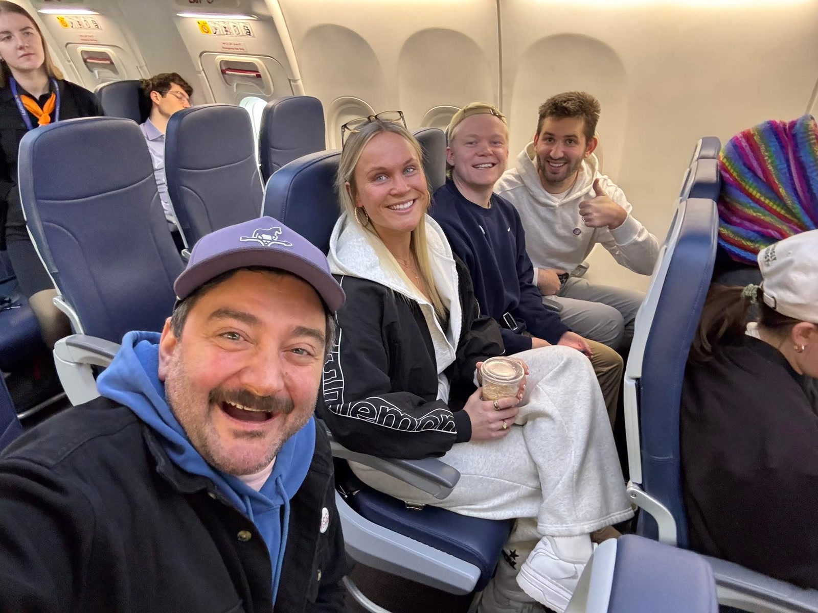 Tony with members of the Joshlilj team aboard a flight.