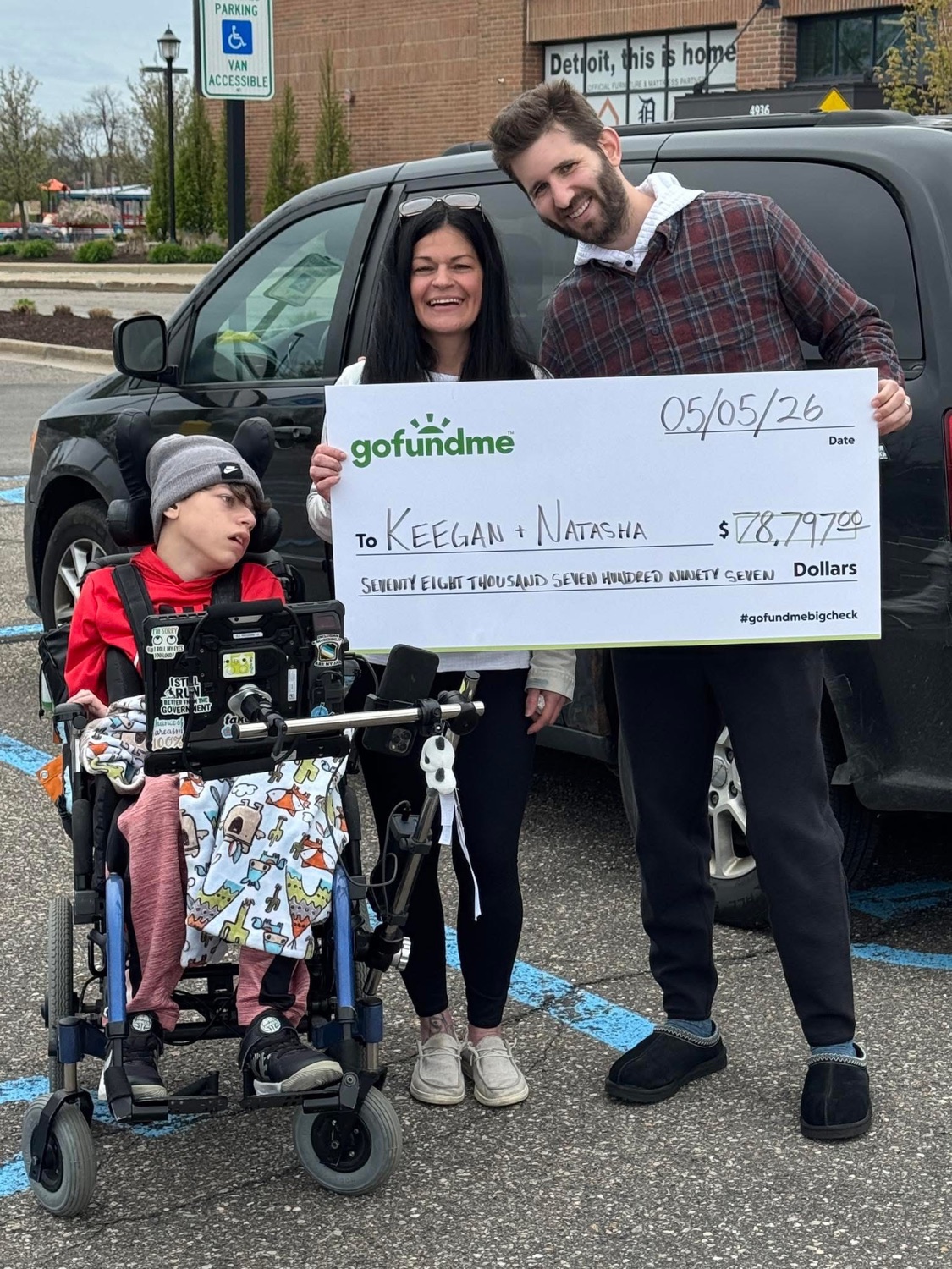 Josh Liljenquist with Keegan, Natasha, and a GoFundMe check
