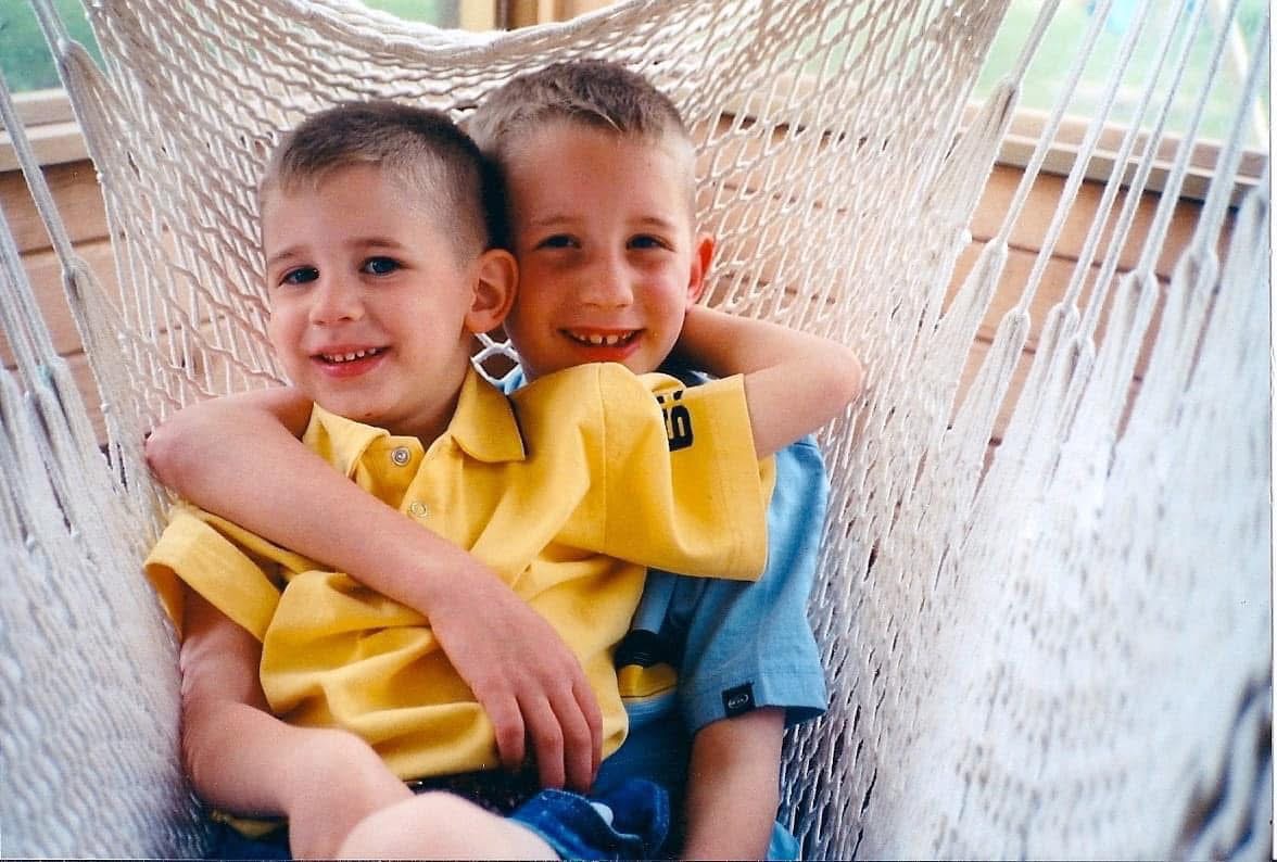 Josh and Jacob Liljenquist as children sitting together in a hammock