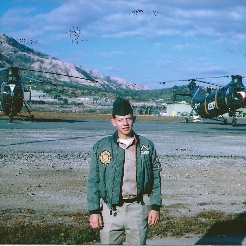 Tom Westcott in military uniform at an airfield during his service connected to Vietnam