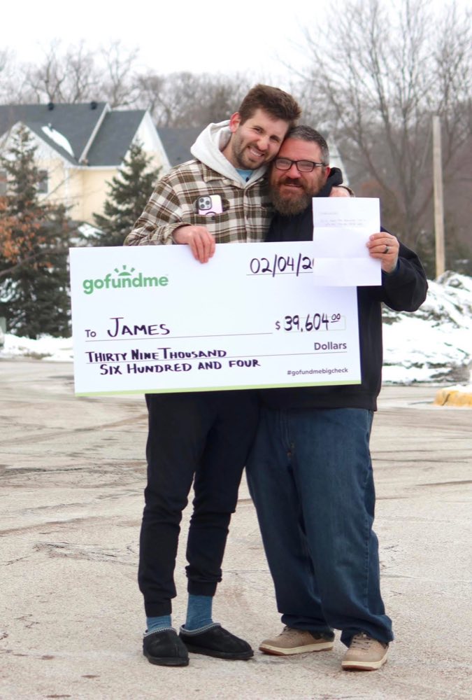 Josh Liljenquist with James and a GoFundMe check