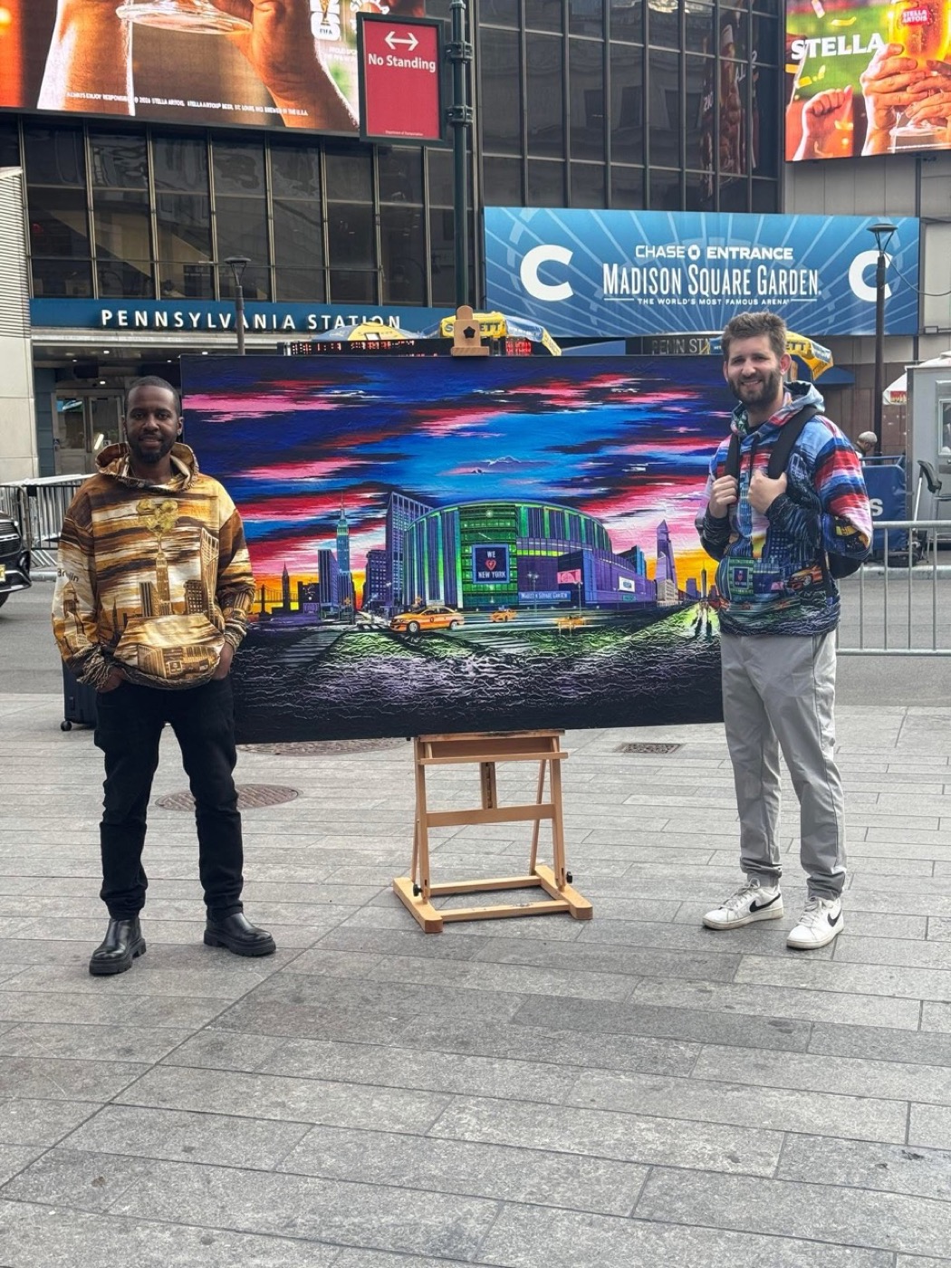 Josh Liljenquist with a New York artist and a Madison Square Garden painting
