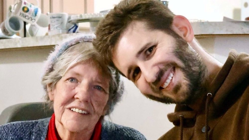 Josh Liljenquist sitting with Shirley after giving her fundraiser support