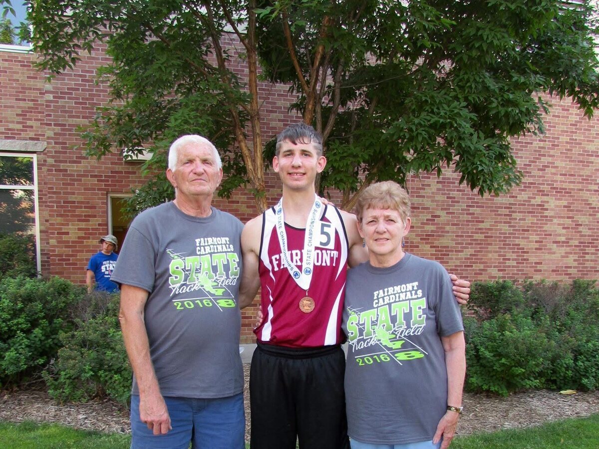 Josh Liljenquist with his grandparents Lee and Corrine after a 2016 state track and field event.