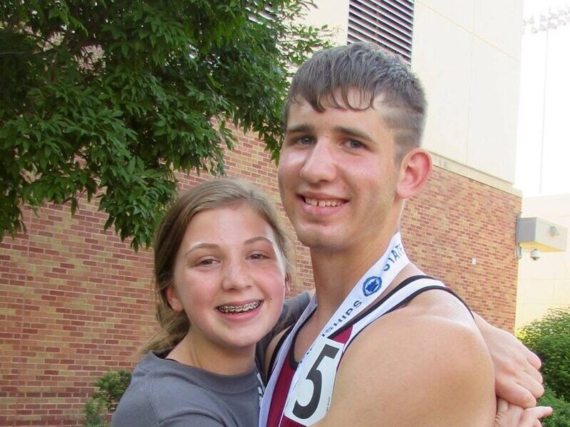 Andrea Westcott hugging her cousin Josh Liljenquist after one of Josh's track events.