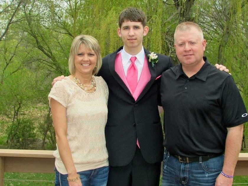 Josh Liljenquist with Carrie and Mark Westcott at a formal event.