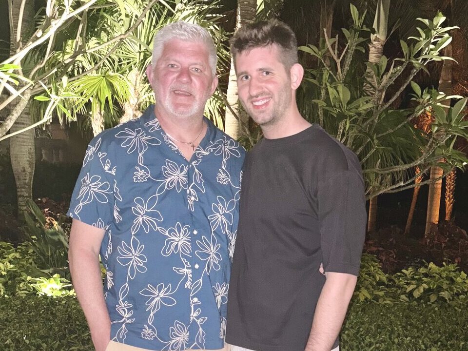 Josh Liljenquist standing with his father, Trent Lee Liljenquist, outdoors at night during a family trip.