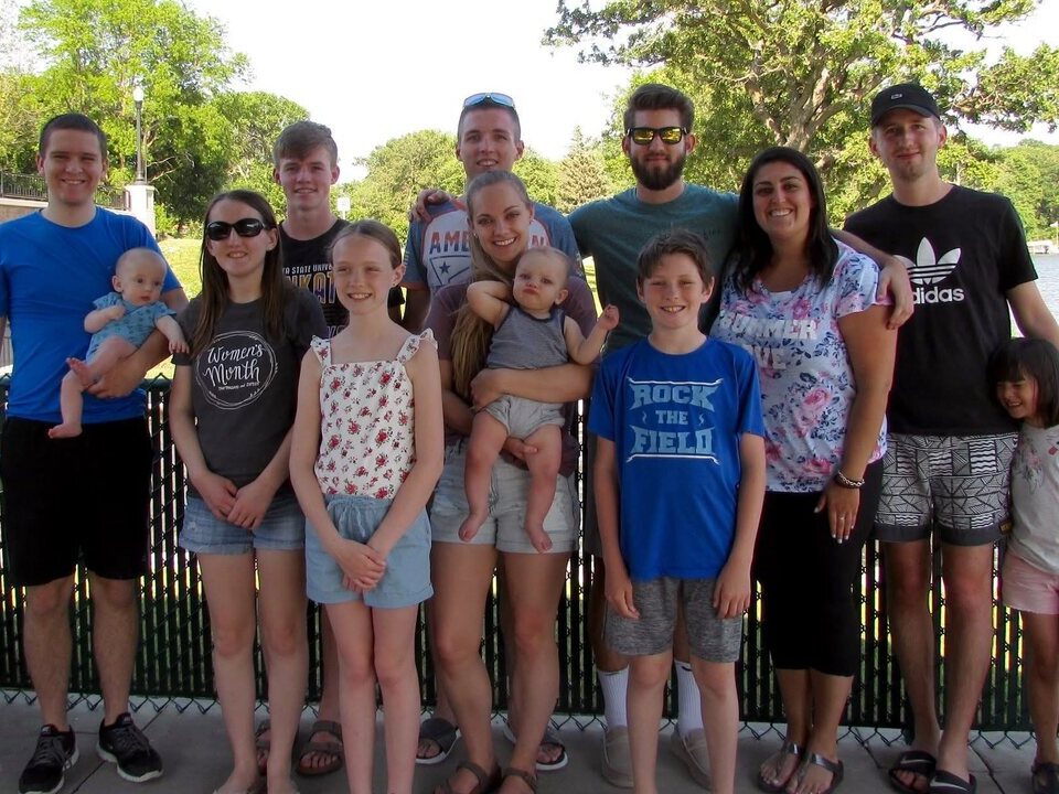 Members of the Eckdahl family gathered together beside the water.