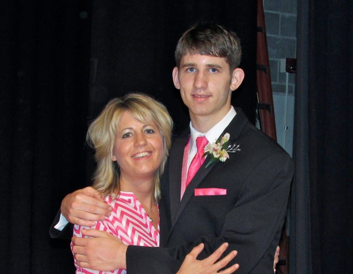A younger Josh Liljenquist with his mother, Julie Ann Liljenquist, at a formal event.