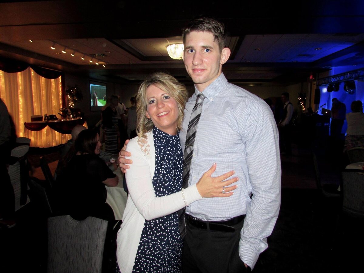 Josh Liljenquist with his mother, Julie Ann Liljenquist, at a family or formal event.