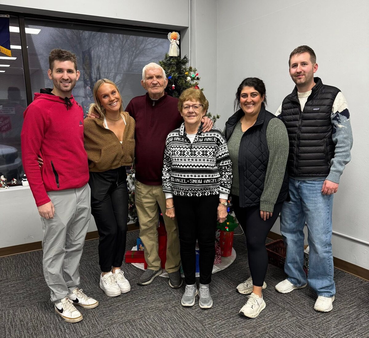 Lee and Corrine Liljenquist surrounded by family members during a Christmas gathering.