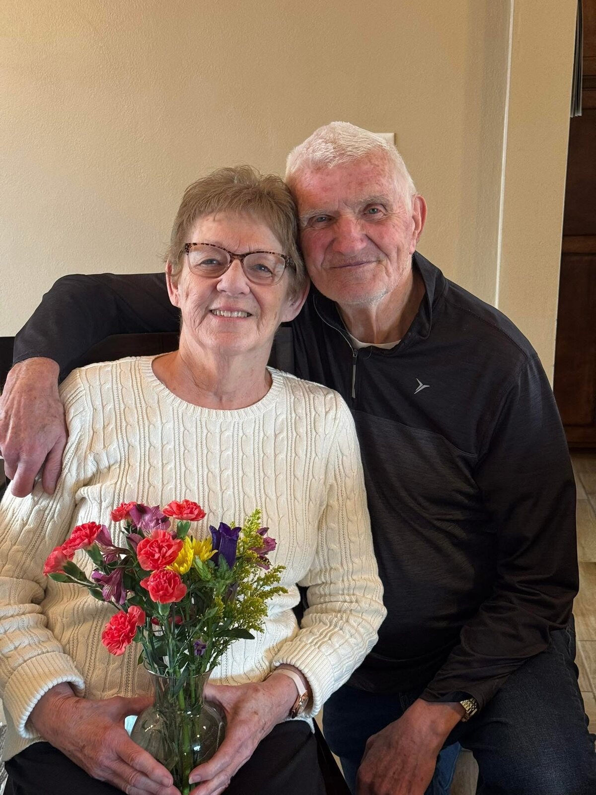 Corrine Liljenquist with her husband, Lee Liljenquist, together with flowers.