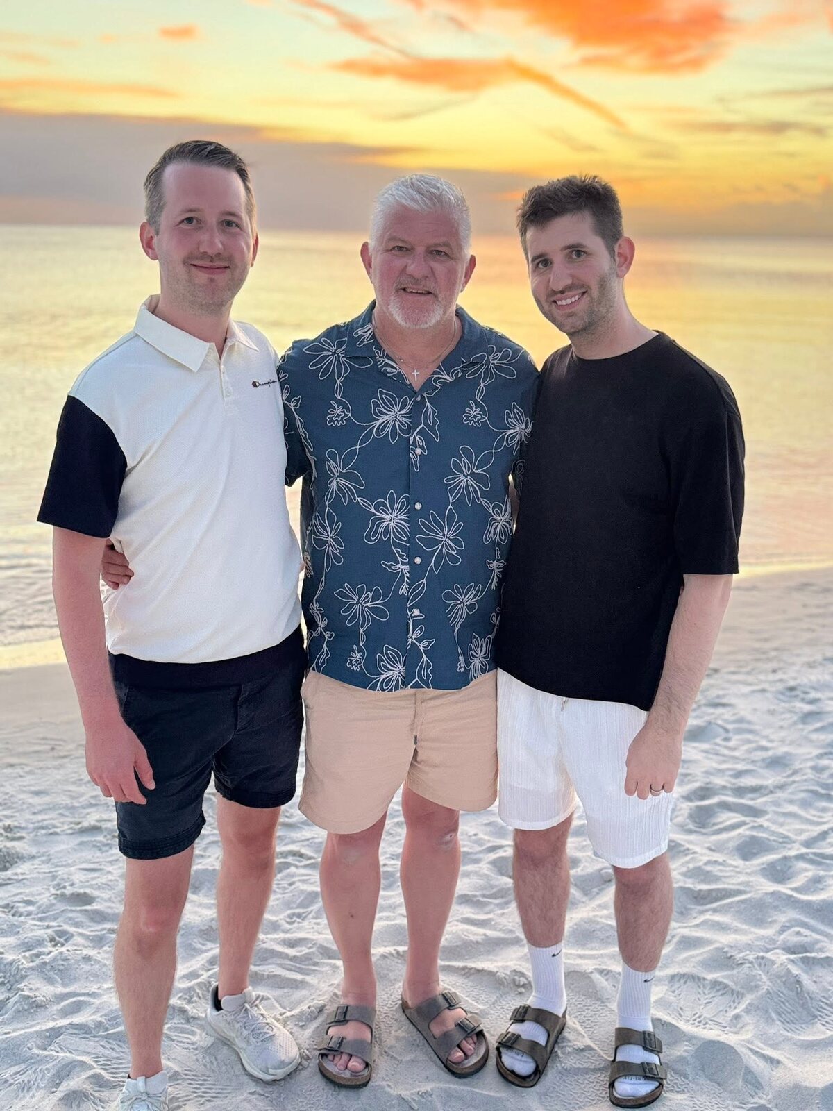 Jacob Liljenquist, Trent Lee Liljenquist and Josh Liljenquist together on a beach at sunset.