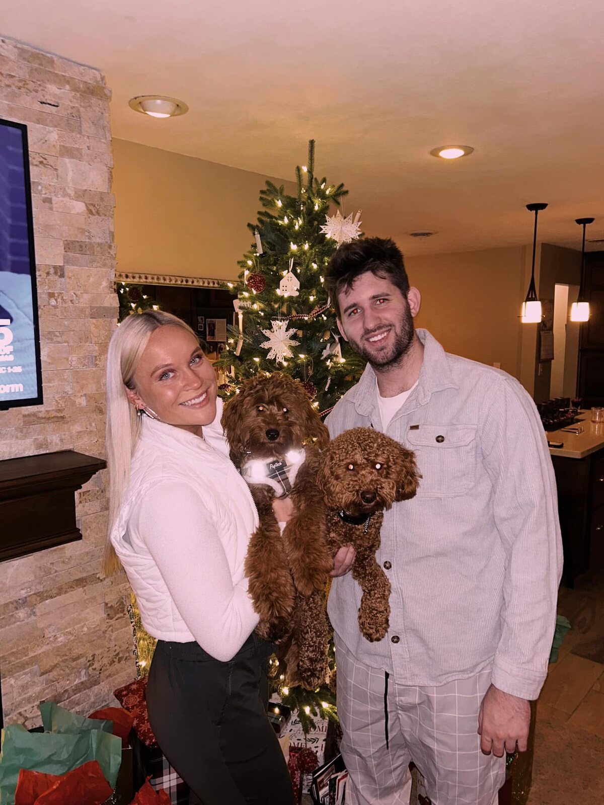Josh and Ingrid with Lola and Leo during the Christmas season at home.