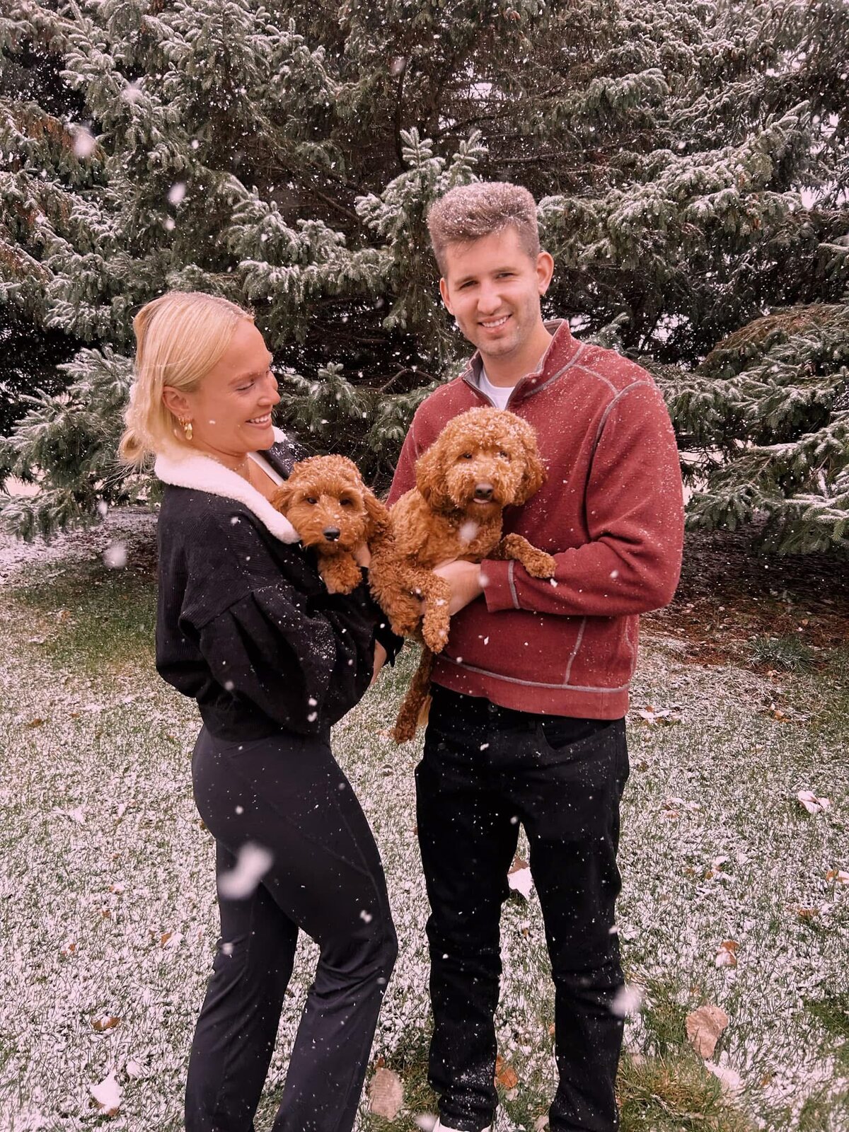 Josh and Ingrid with Lola and Leo during a snowy family moment.