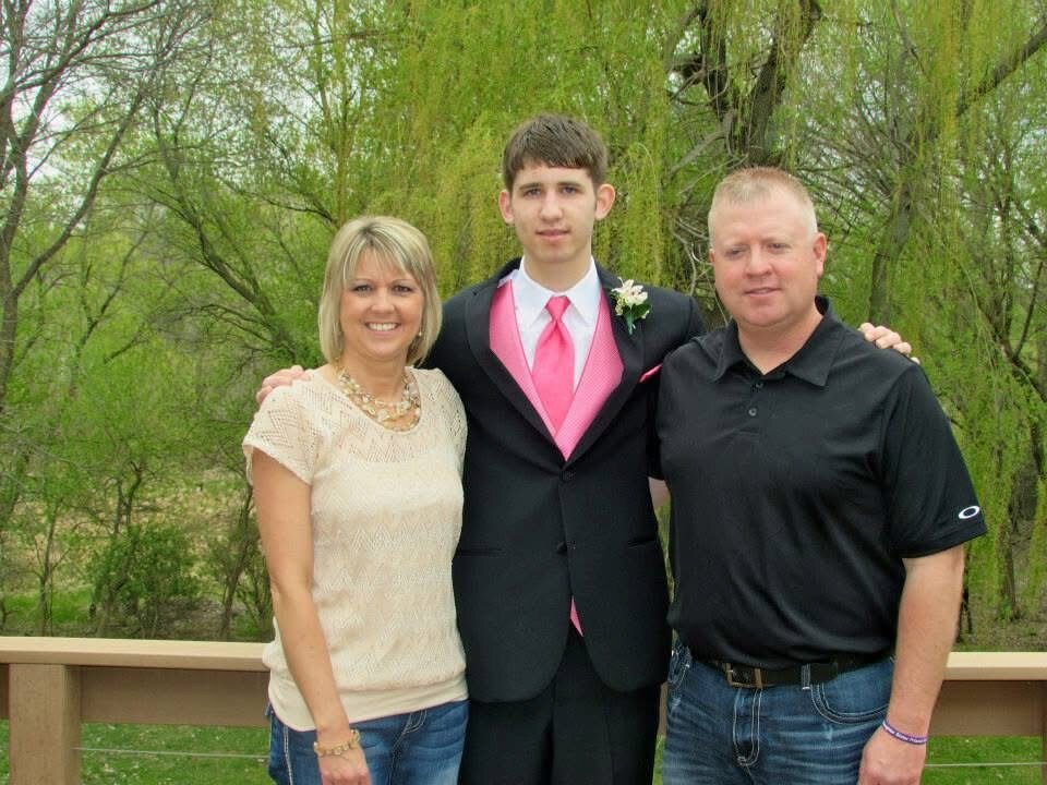 Josh Liljenquist with Carrie and Mark Westcott at a formal event.