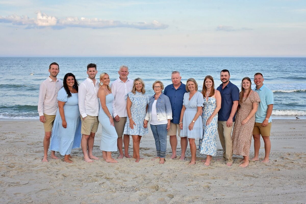 Carrie and Mark Westcott with extended family members during a beach trip.