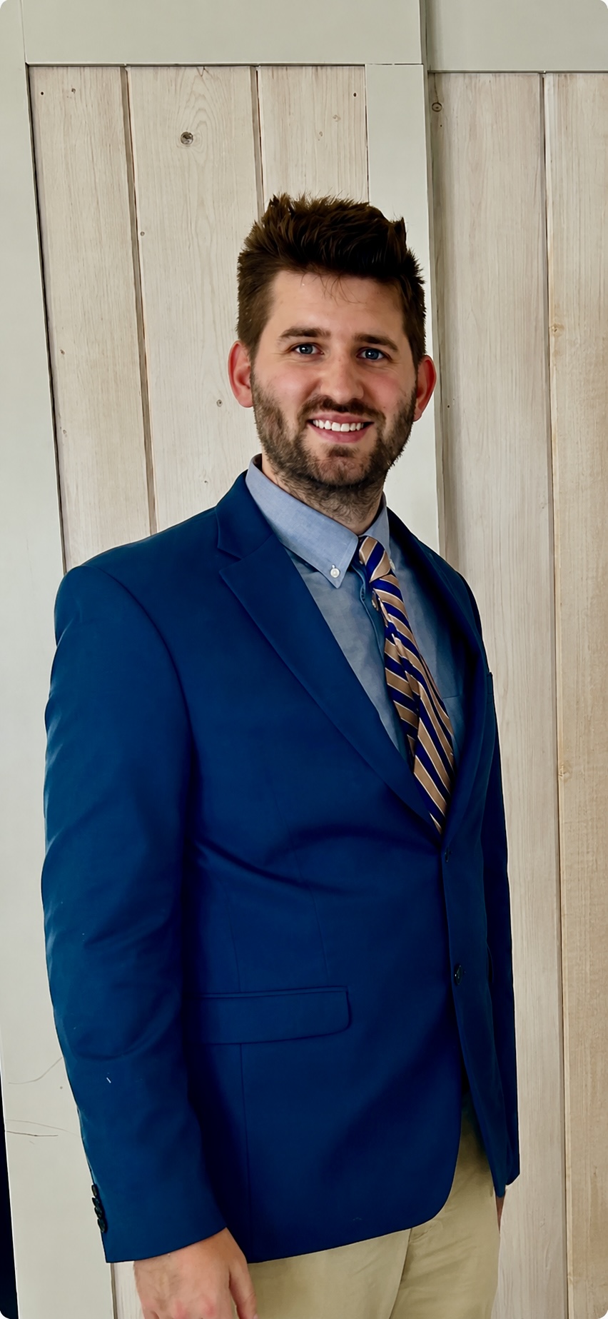 Professional portrait of Josh Liljenquist wearing a blue suit and patterned tie