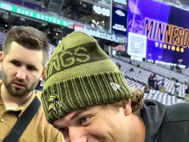 Josh Liljenquist standing with J.J. McCarthy at a Minnesota football event