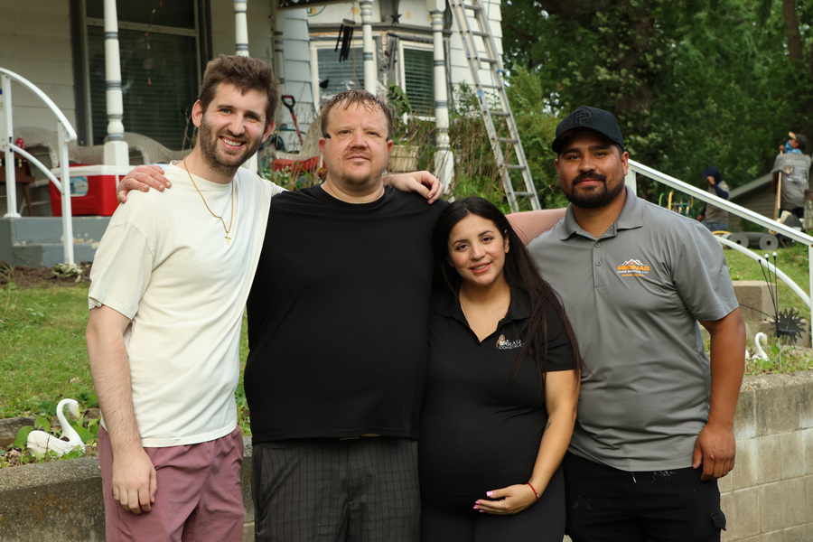 Josh Liljenquist, Nick and the roof-and-gutter project team posing together in Brownton