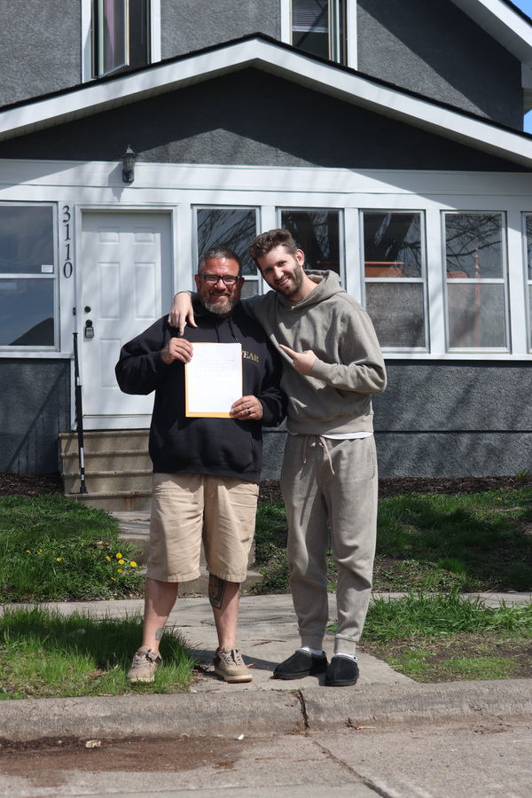 Josh Liljenquist standing with James Cowan Jr. during the employment follow-up