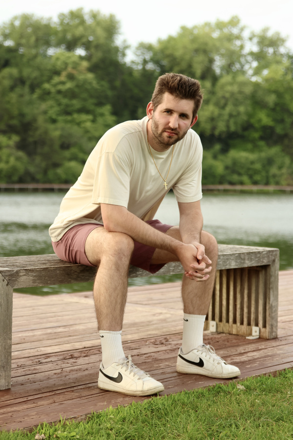 Josh Liljenquist seated beside the water at Firemen's Park in Chaska