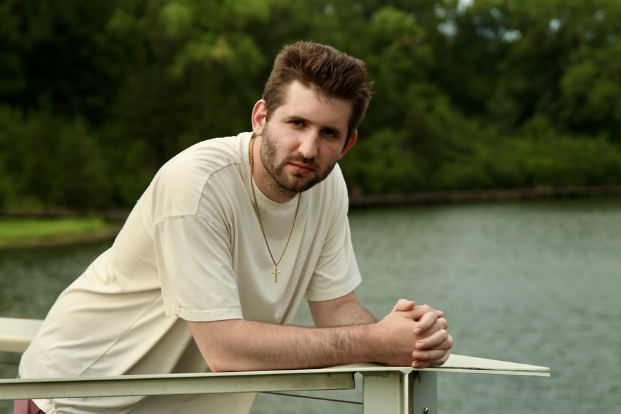 Serious lakeside portrait of Josh Liljenquist at Firemen's Park in Chaska