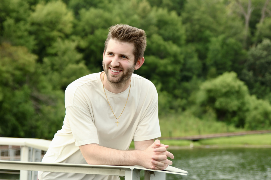 Josh Liljenquist smiling beside the water at Firemen's Park in Chaska