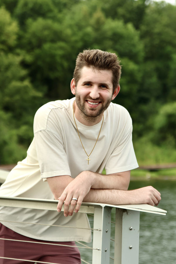 Vertical outdoor portrait of Josh Liljenquist beside the water at Firemen's Park