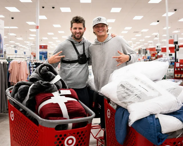 Josh Liljenquist with J.J. McCarthy at Target in Saint Paul, Minnesota, on February 8, 2025, while buying warm supplies for people experiencing homelessness.