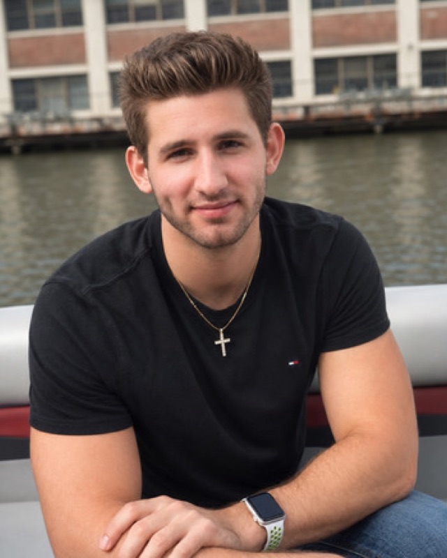 Casual lifestyle portrait of Josh Liljenquist seated on a boat