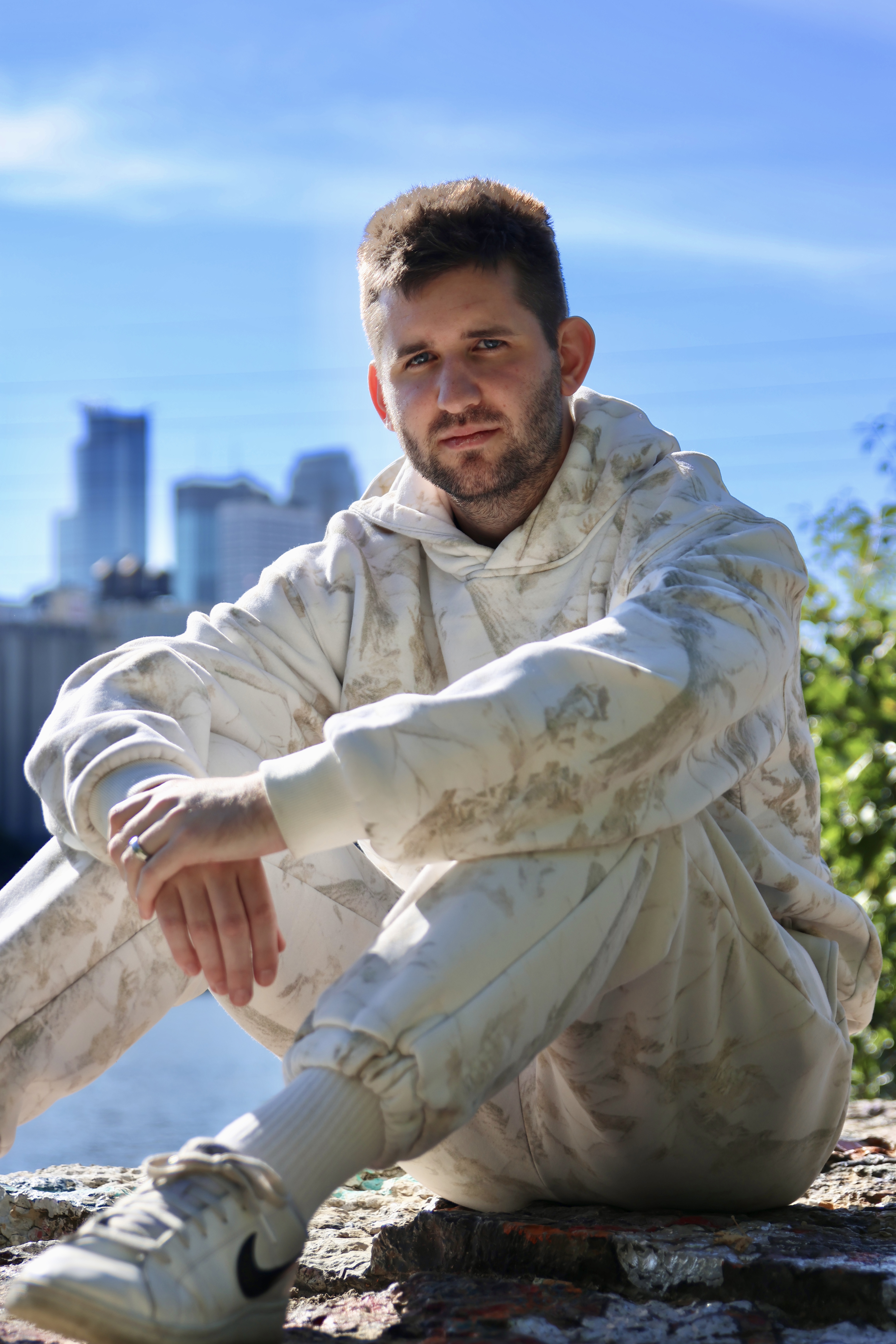 Josh Liljenquist in an outdoor portrait overlooking the Minneapolis skyline