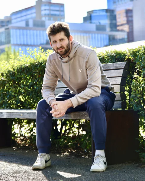 Josh Liljenquist seated on a bench near U.S. Bank Stadium in Minneapolis, Minnesota, September 2026.
