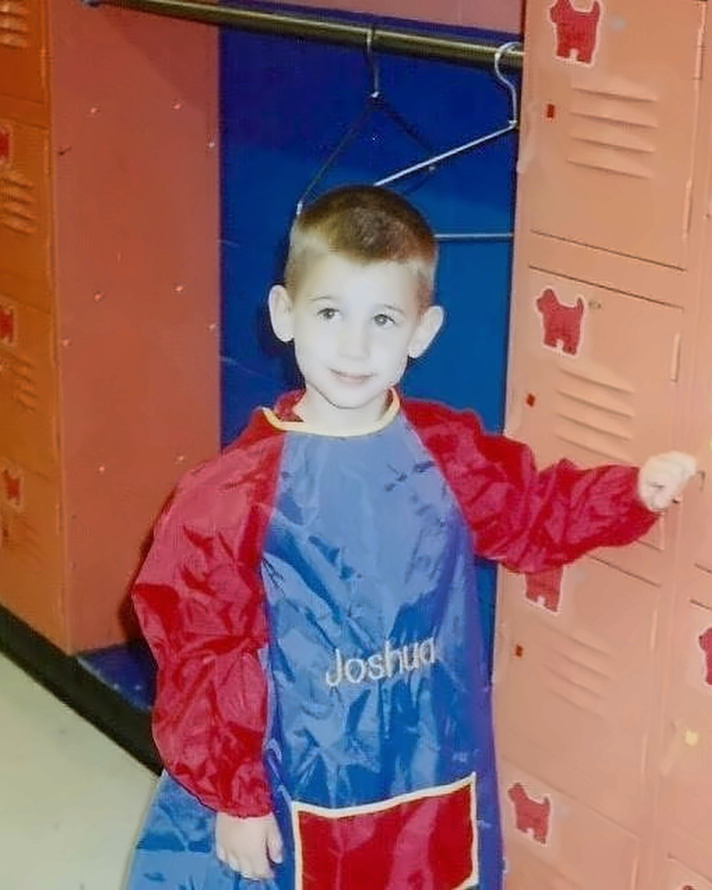 Restored childhood photograph of Josh Liljenquist standing beside school lockers