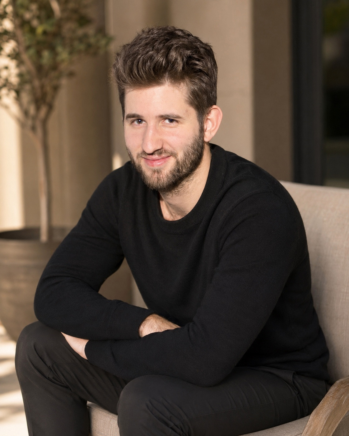 Editorial portrait of Josh Liljenquist seated in a black sweater