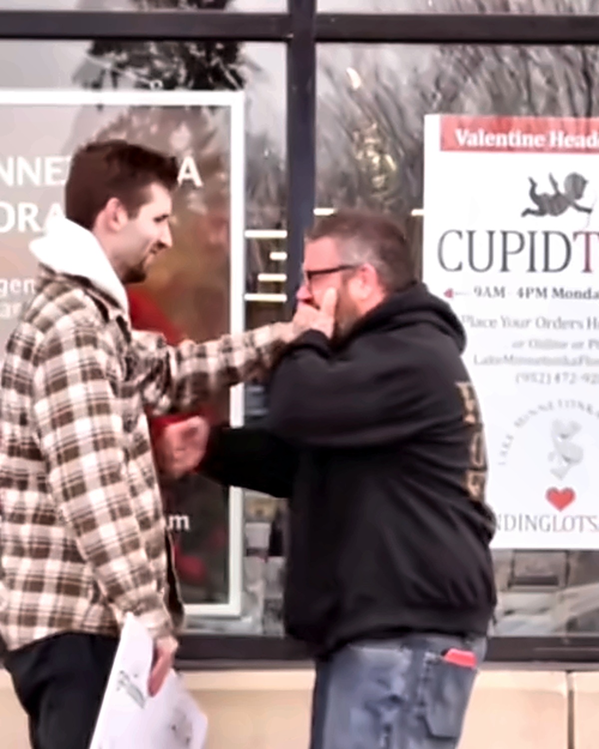 Josh Liljenquist speaking with a participant outside a floral business during a documented fundraiser outcome
