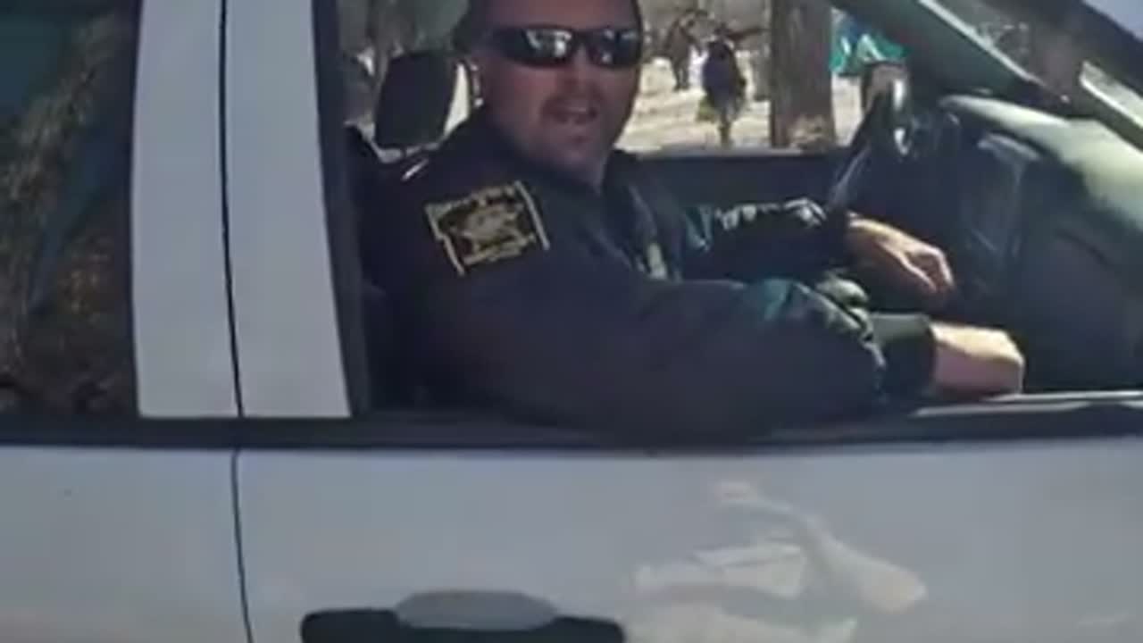 Ramsey County Sheriff’s Office vehicle and uniformed Sheriff personnel at the documented outreach