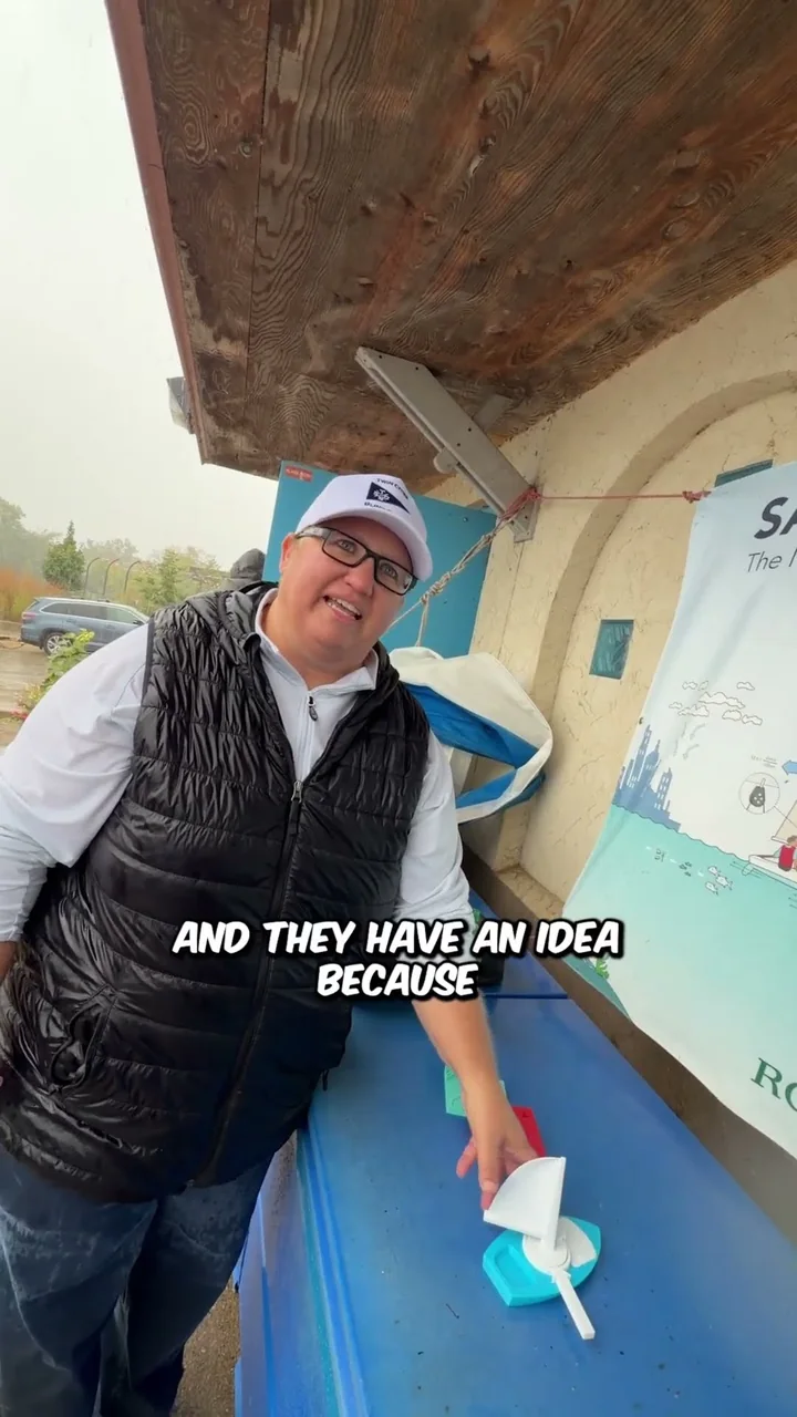 A participant explains accessible sailing beside a tactile teaching display in Josh's published video